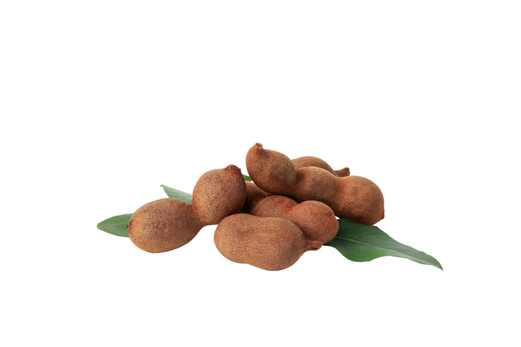 png,ripe tamarind with leaves, isolated on white background